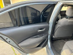 Interior view of a 2020 Toyota Corolla LE showing back door and seating area in excellent condition.